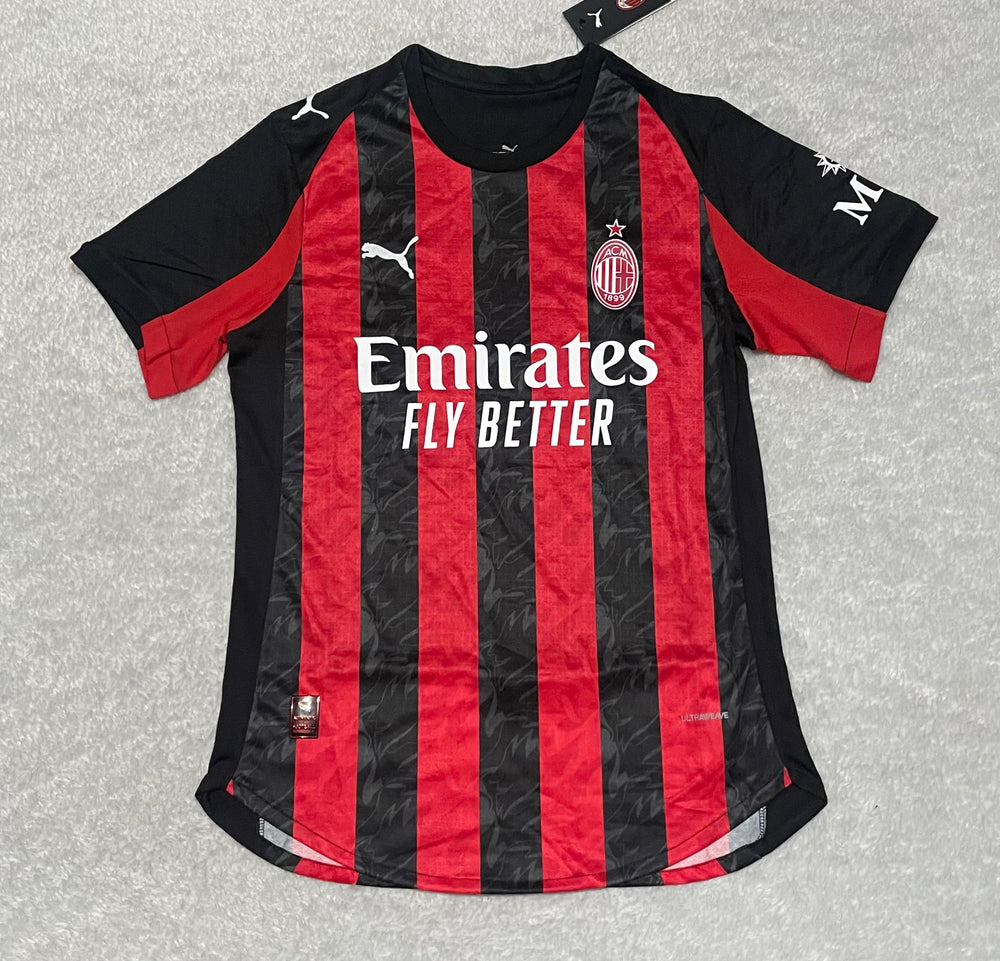 camisa camiseta blusa do milan nova lançamento da temporada 2025/26 25/25 i 1 titular principal primeira home listrada vermelha e preta masculina versão jogador tailandesa réplica pro mantos