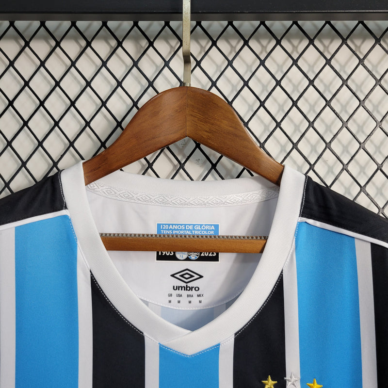 comprar-camisa-camiseta-blusa-do-grêmio-nova-lançamento-da-temporada-2023-24-feminina-baby-look-i-1-titular-principal-tricolor-listrada-com-listras-primeira-azul-preto-preta-e-branco-branca-tailandesa-réplica-de-time-de-futebol