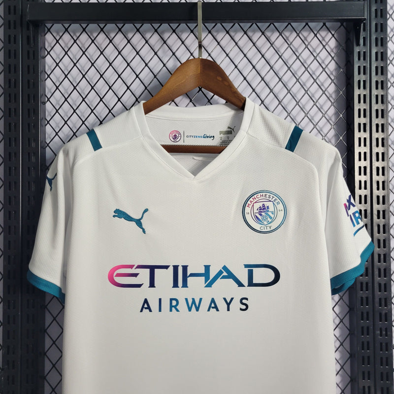 comprar-camisa-camiseta-blusa-do-manchester-city-branca-da-temporada-2021/2022-21/22-ii-2-segunda-reserva-e-com-azul-brilhante-masculina-versão-modelo-torcedor-tailandesa-réplica-de-time-de-futebol